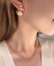 Серьги Dior c жемчужным бантом и CD-подвеской
