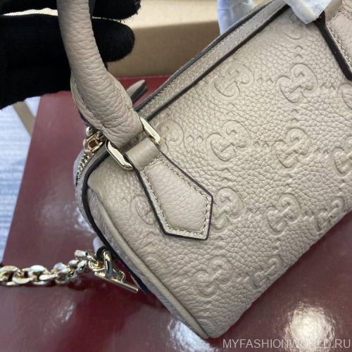 Экстра маленькая сумка с ручкой GG Emblem