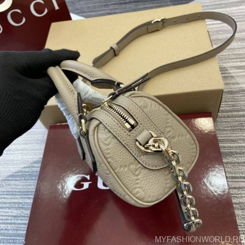 Экстра маленькая сумка с ручкой GG Emblem
